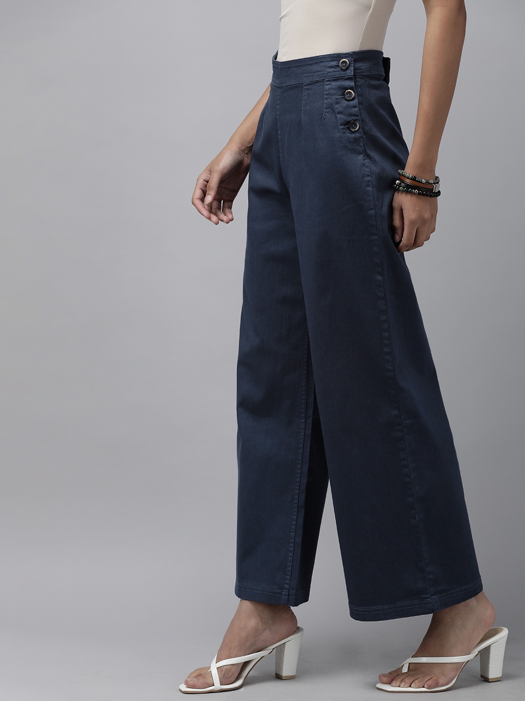 

Roadster Women Blue Solid Flared High-Rise Easy Wash Pleated Woven Parallel Trousers