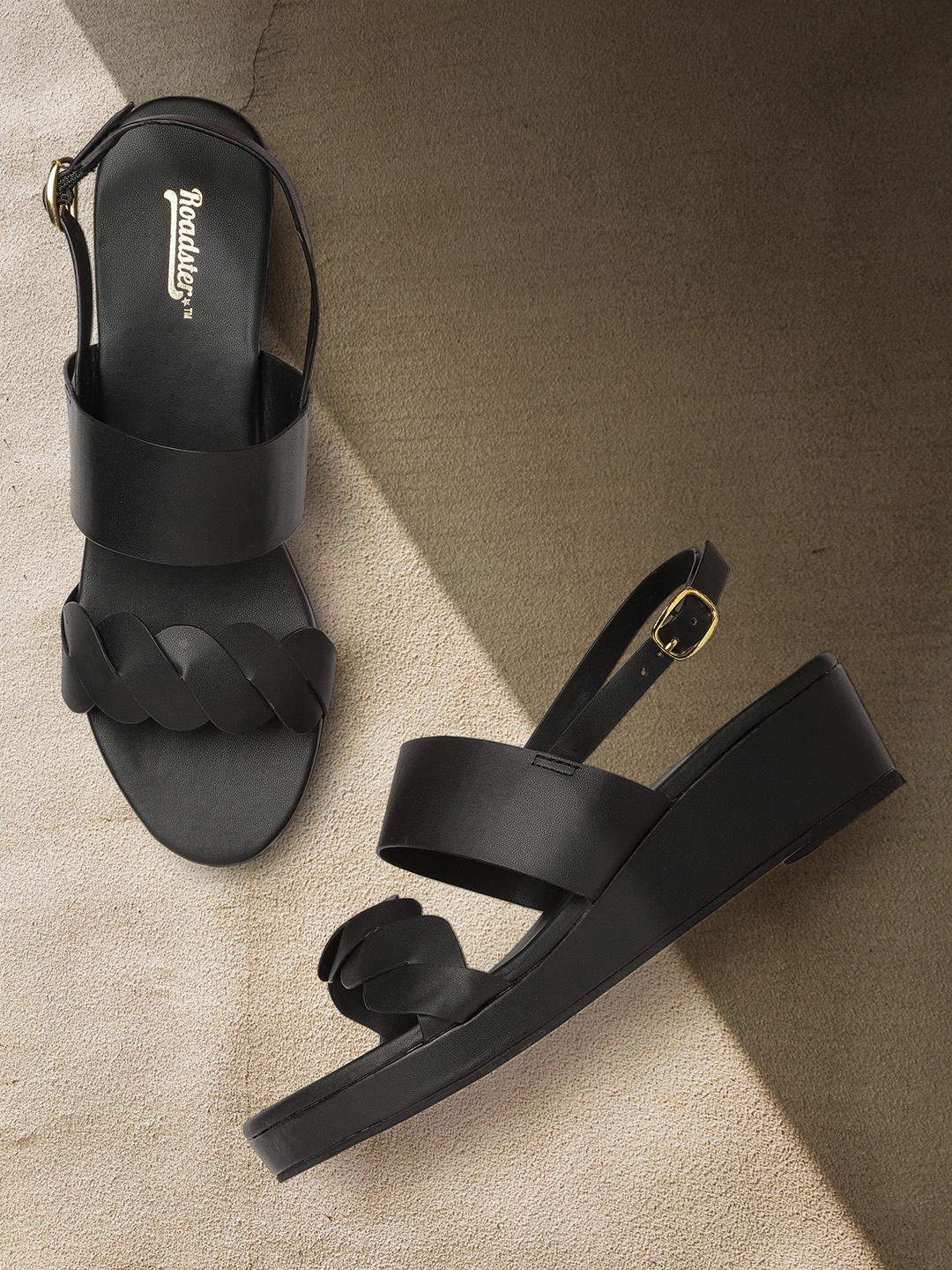 

Roadster Women Black Solid Wedges with Overlapping Detail