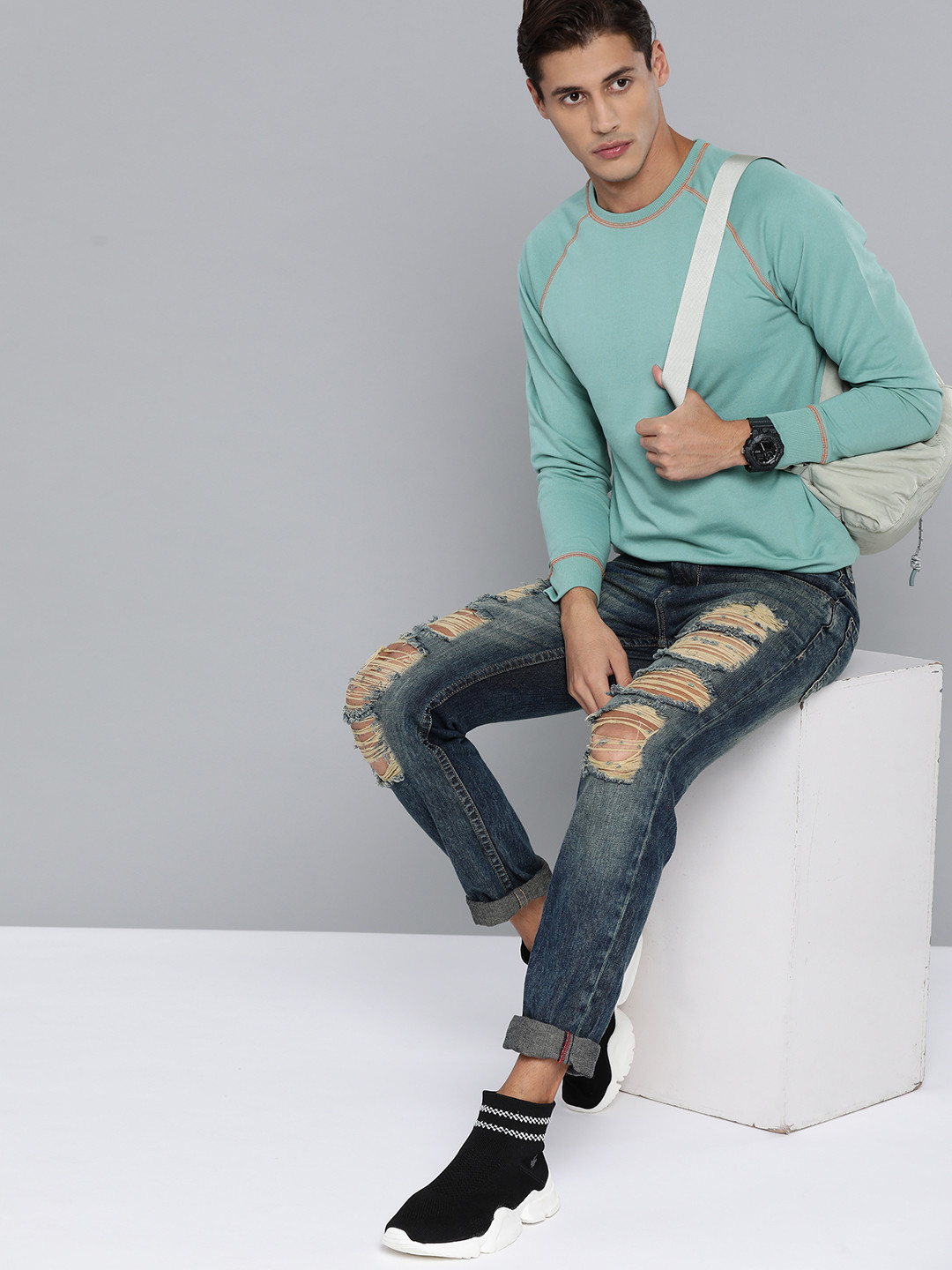 

Kook N Keech Men Green Solid Sweatshirt