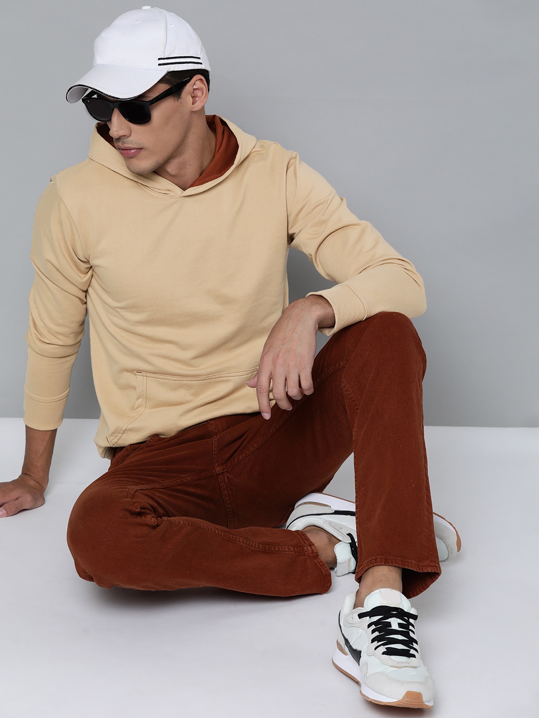 

Kook N Keech Men Beige Solid Hooded Sweatshirt