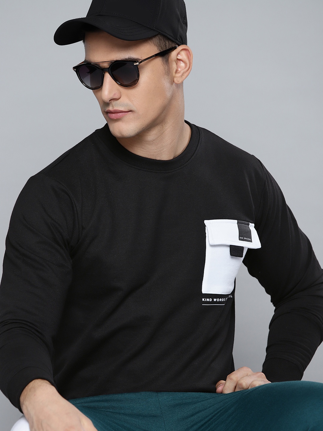 

Kook N Keech Men Black Solid Sweatshirt