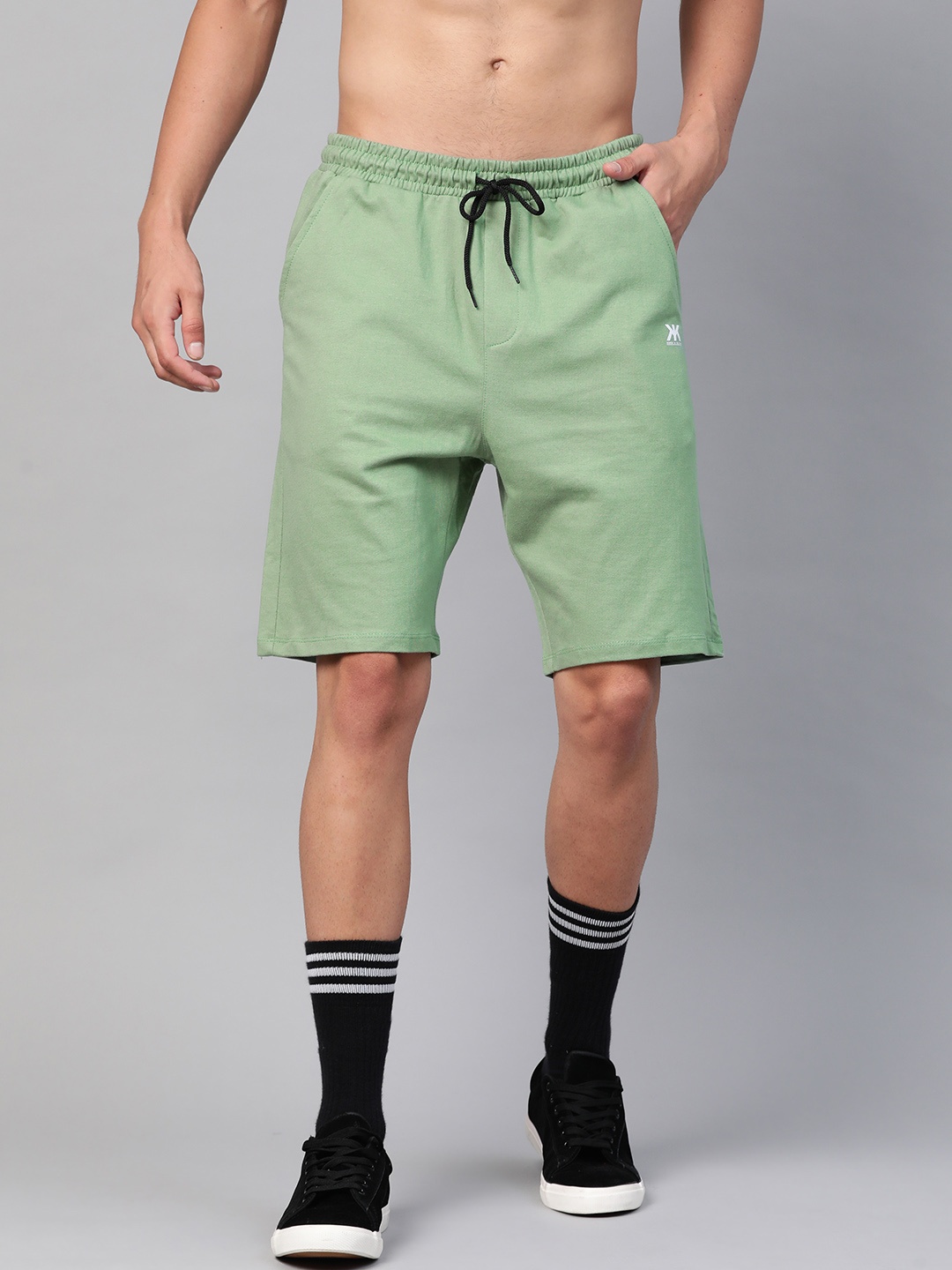 

Kook N Keech Men Green Solid Mid-Rise Regular Shorts