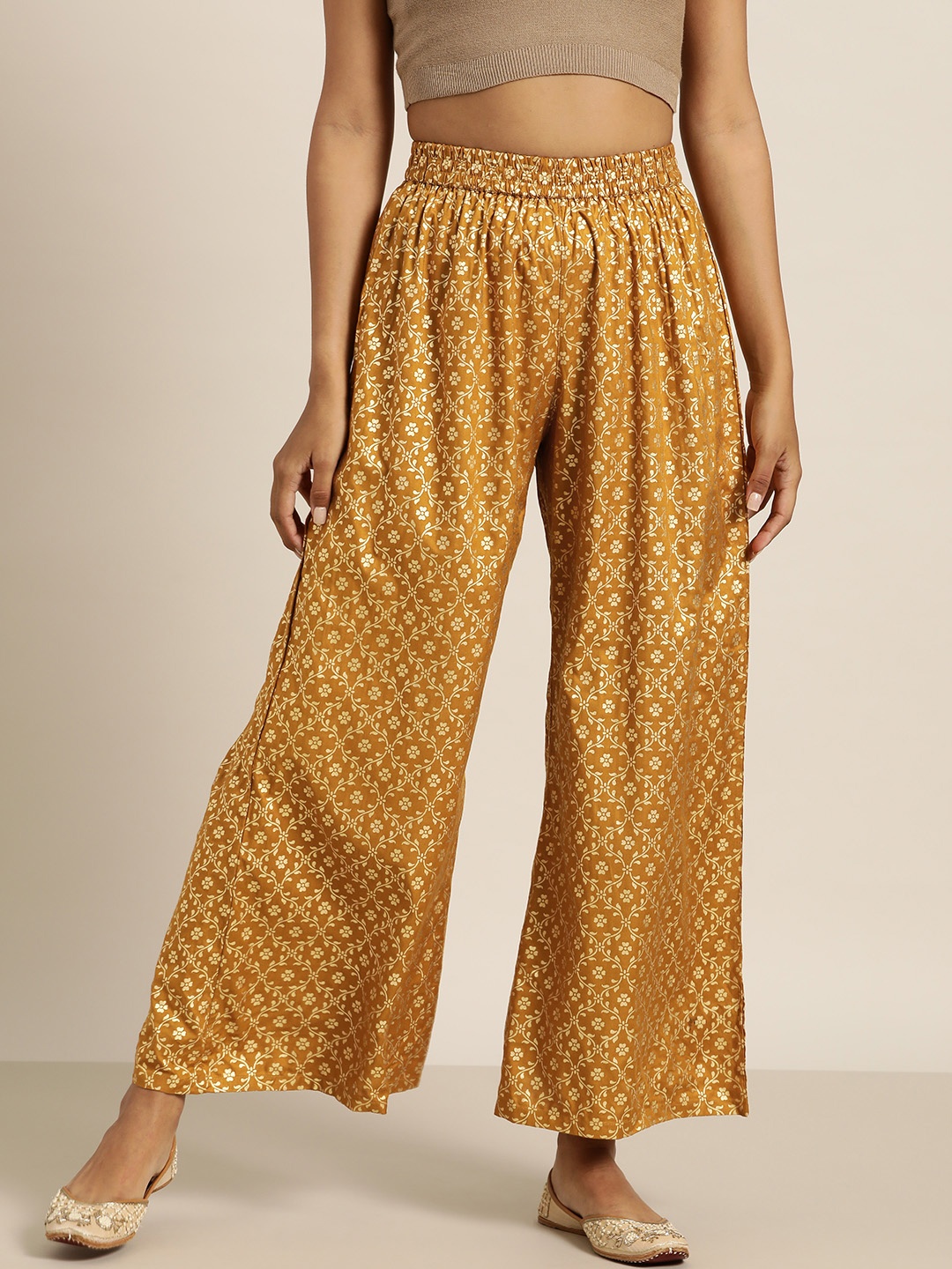 

Shae by SASSAFRAS Women Mustard Yellow & Golden Ethnic Motifs Printed Liva Palazzos