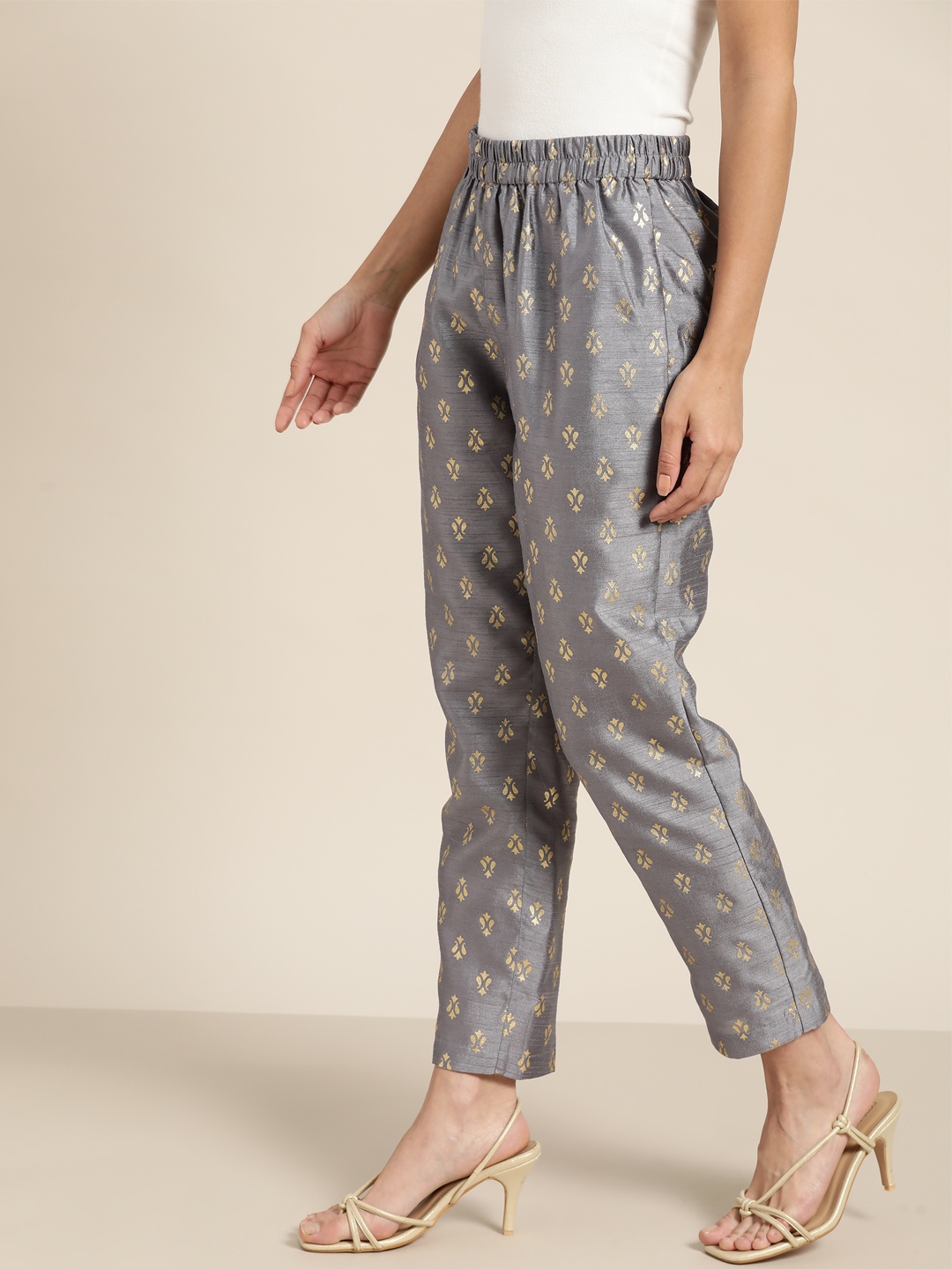 

Shae by SASSAFRAS Women Grey & Golden Ethnic Motifs Printed Pleated Trousers