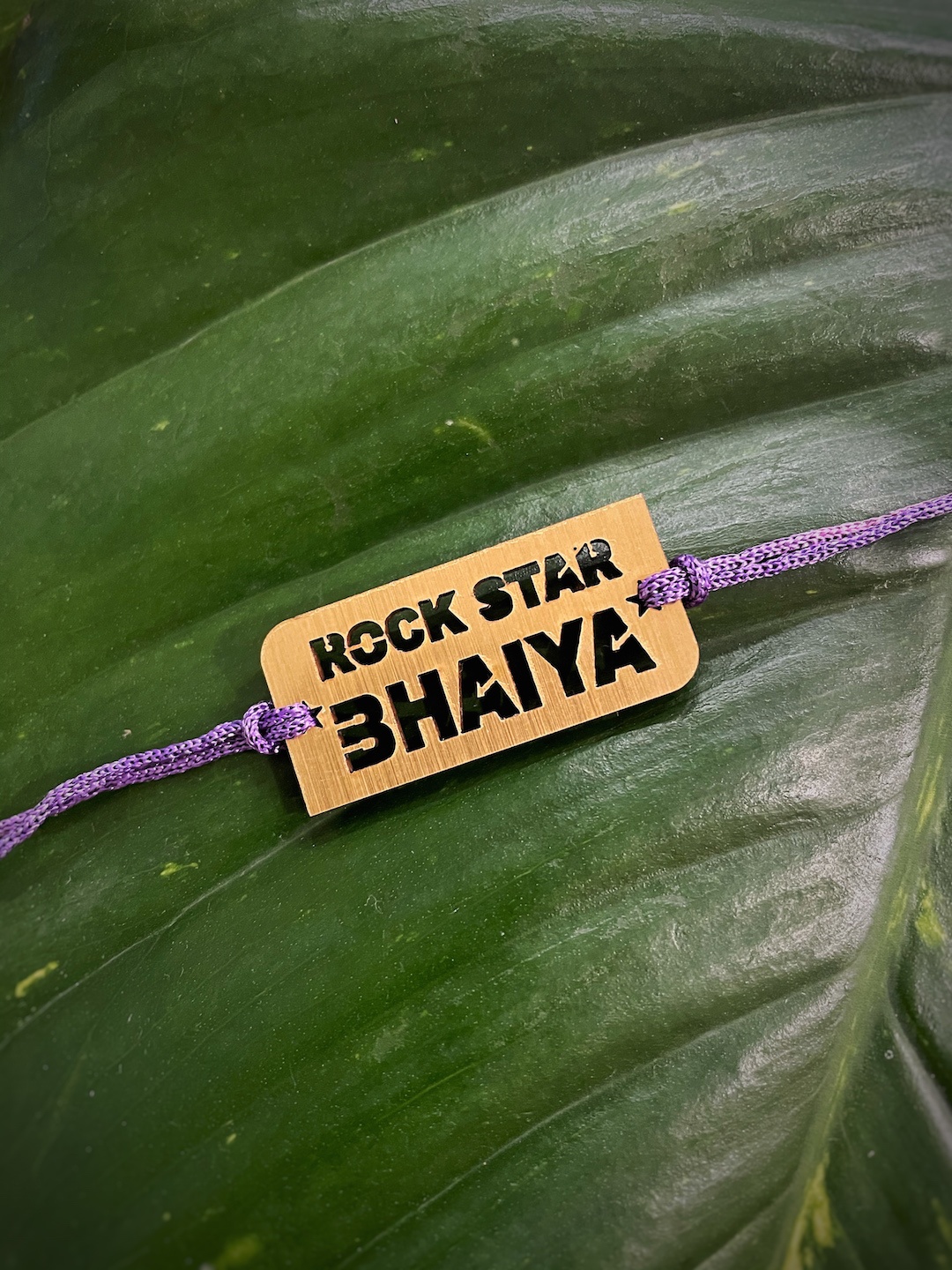 

Digital Dress Room Gold-Toned Fancy Rakhi Design Funky Slogan Rockstar Bhaiya Mauli Rakhi