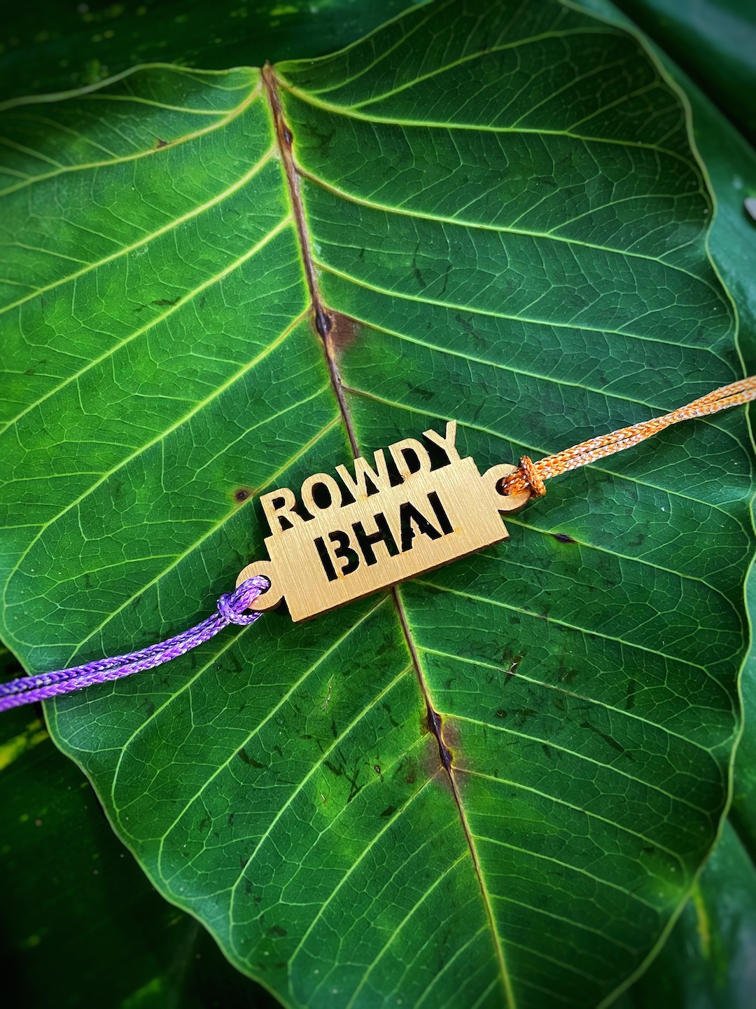 

Digital Dress Room Multicoloured Funky Slogan Rowdy Bhai Pendant Rakhi, Multi