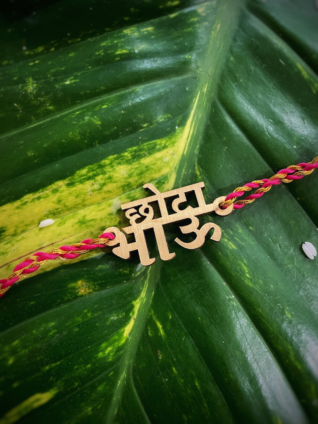 

Digital Dress Room Gold-Toned Rakhi with Chota Bhau Slogan