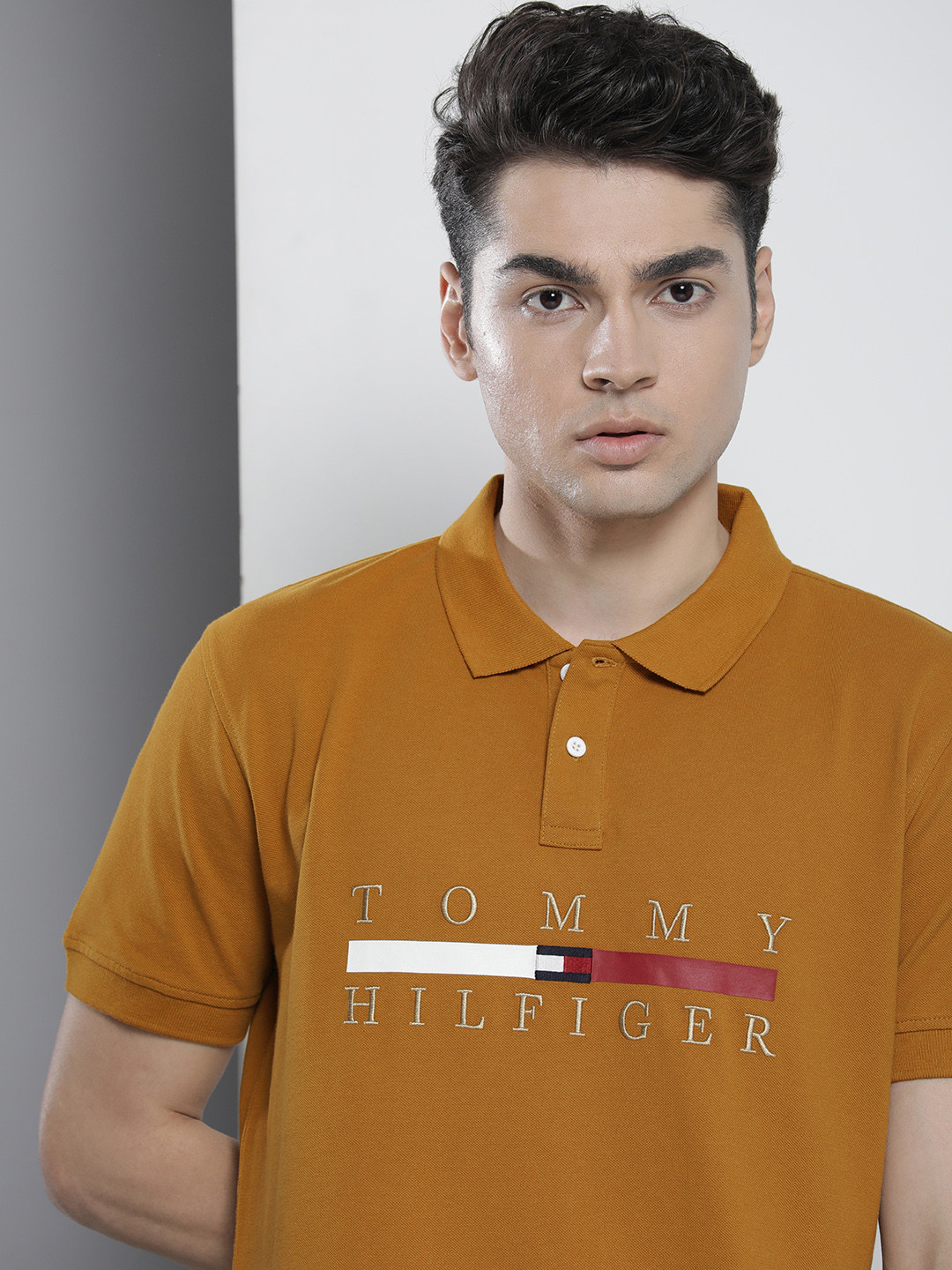 

Tommy Hilfiger Men Mustard Yellow Embroidered Polo Collar Organic Cotton T-shirt