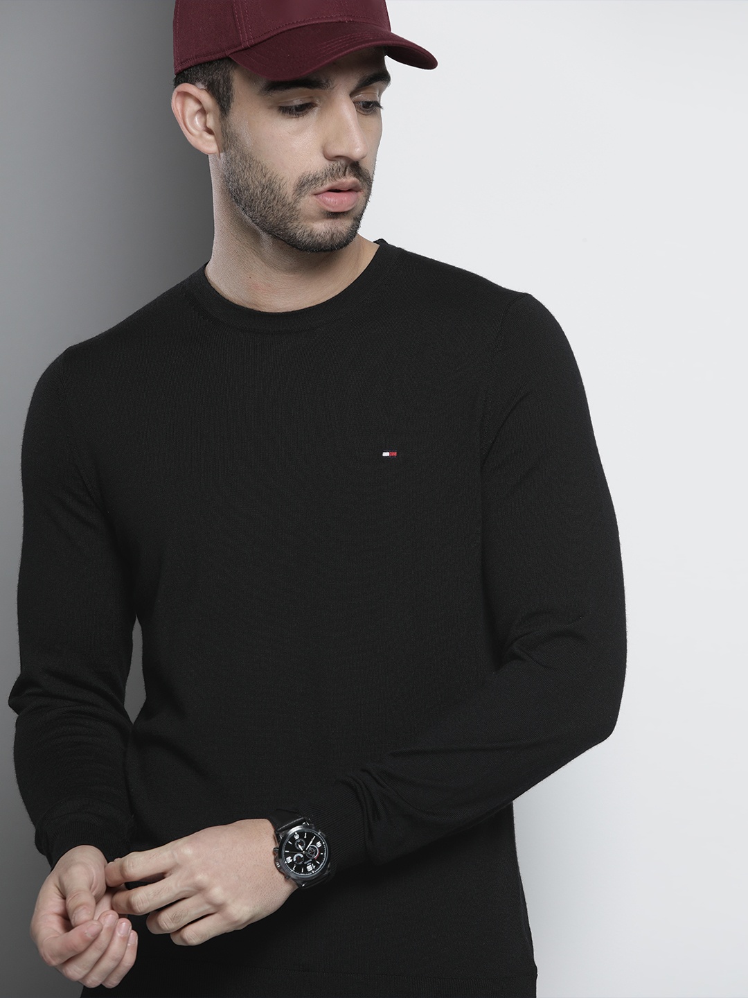 

Tommy Hilfiger Men Black Solid Pullover Sweater