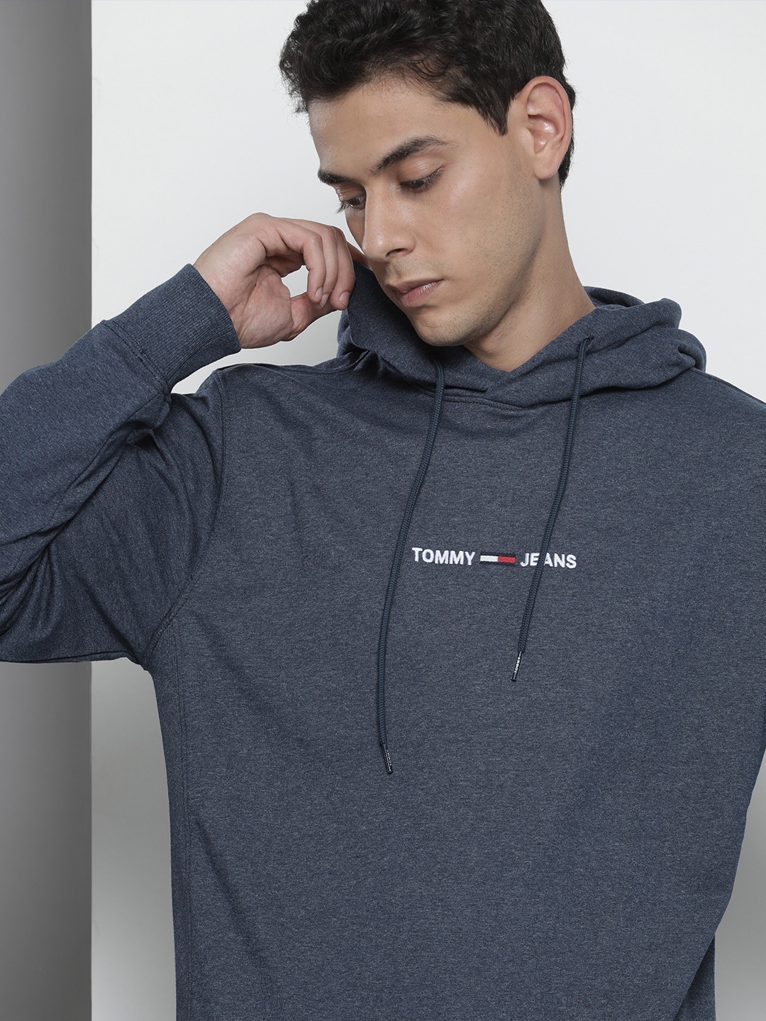 

Tommy Hilfiger Men Navy Blue Solid Embroidered Hooded Sweatshirt