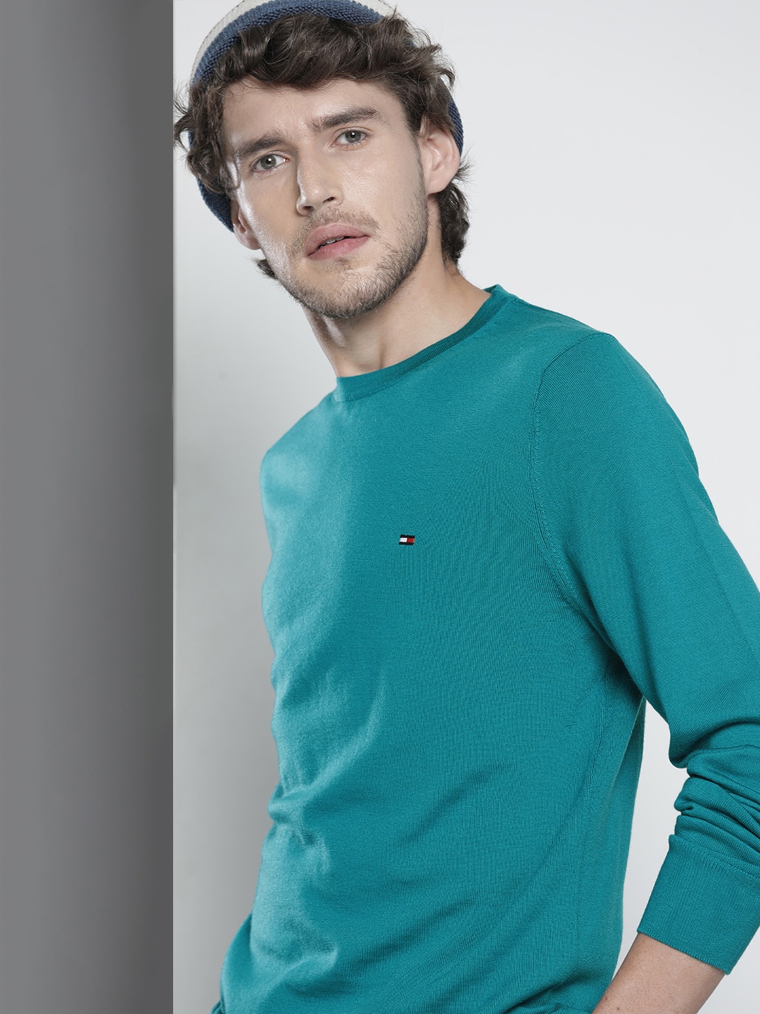 

Tommy Hilfiger Men Turqois Blue Solid Full Sleeved Pullover, Turquoise blue