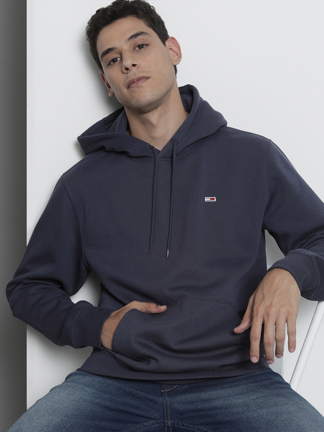 

Tommy Hilfiger Men Navy Blue Solid Hooded Sweatshirt