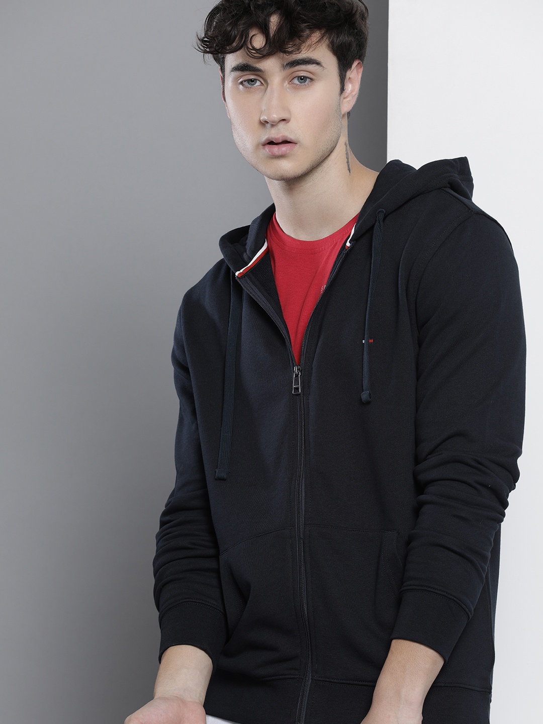 

Tommy Hilfiger Men Navy Blue Solid Hooded Sweatshirt