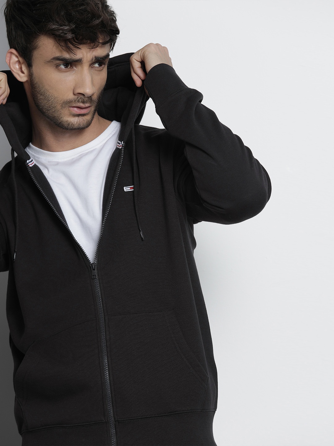 

Tommy Hilfiger Men Black Solid Hooded Sweatshirt