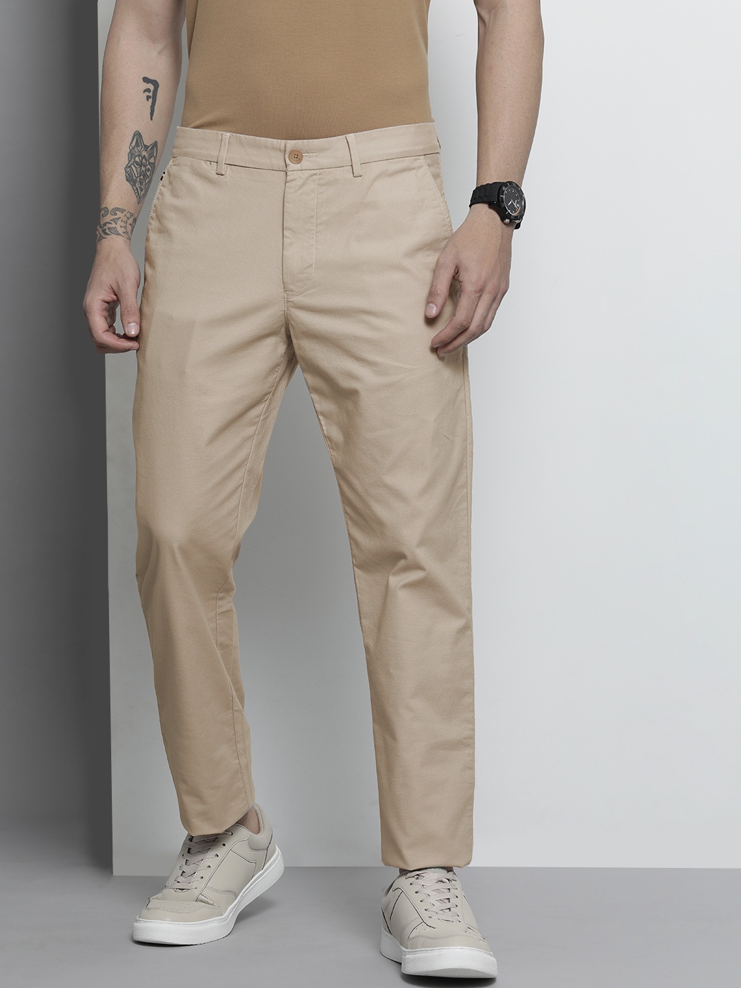 

Tommy Hilfiger Men Beige Solid Trousers