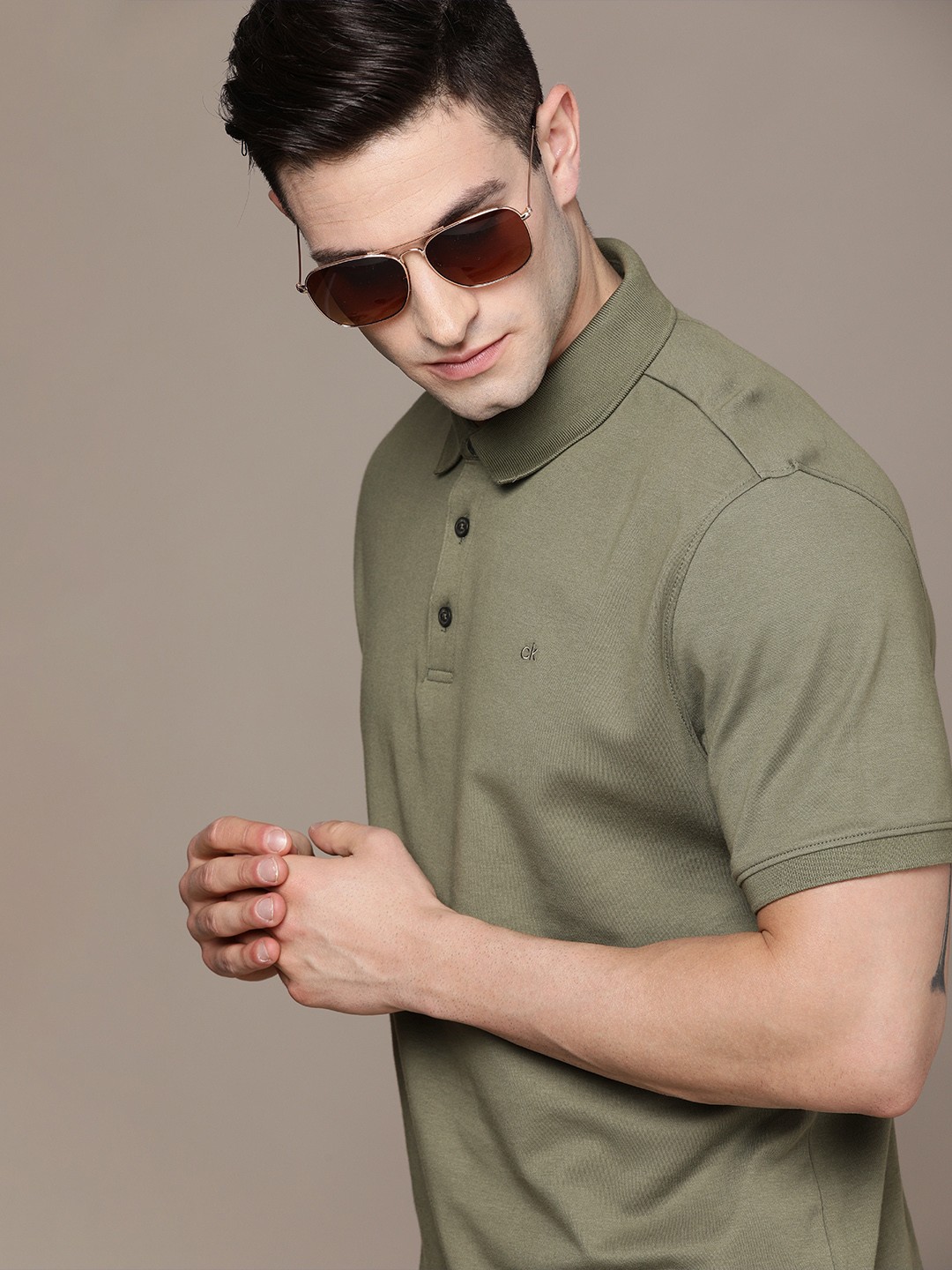

Calvin Klein Jeans Men Olive Green Polo Collar T-shirt