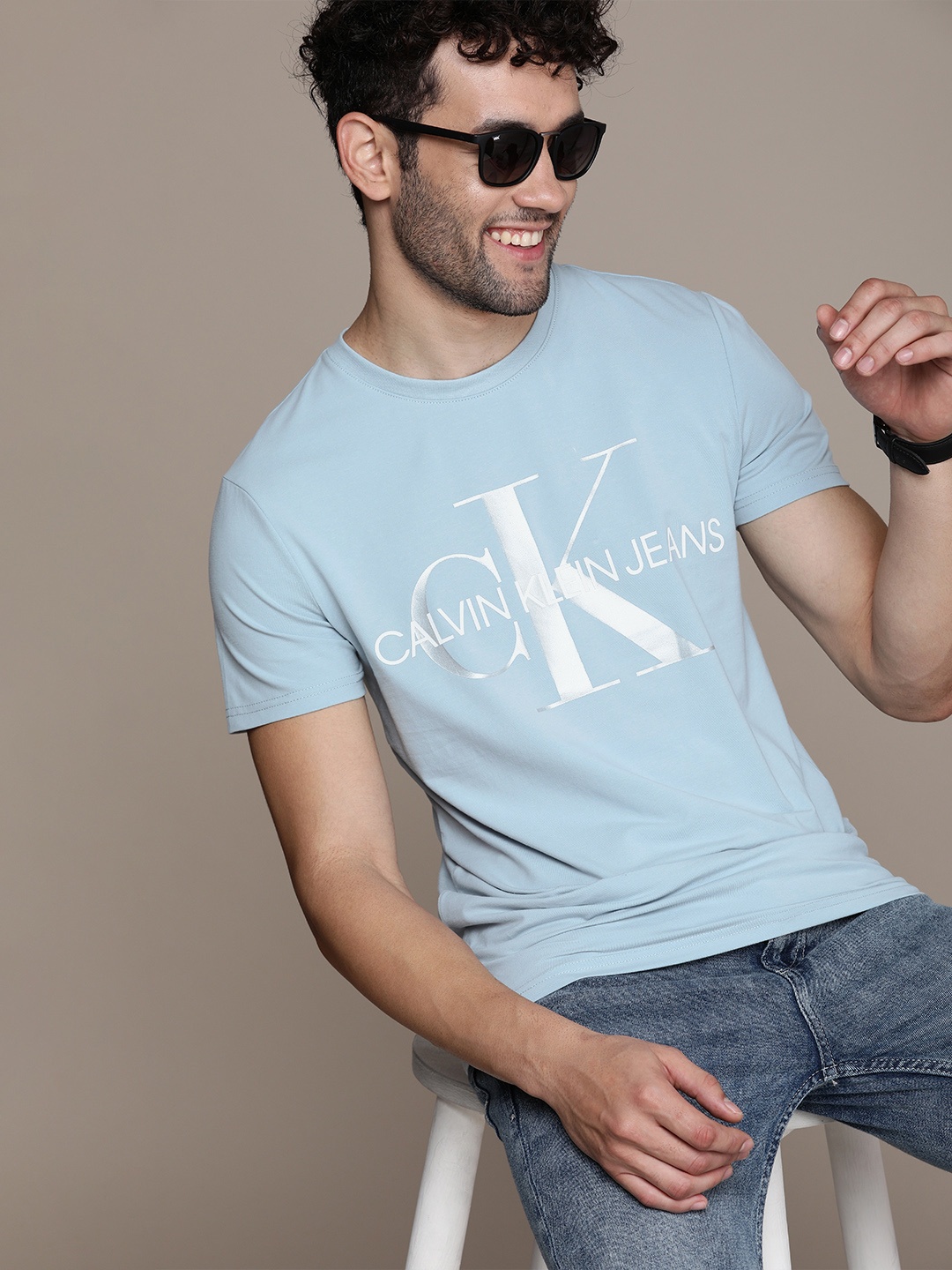 

Calvin Klein Jeans Men Light Blue Logo Printed Slim Fit Casual T-shirt