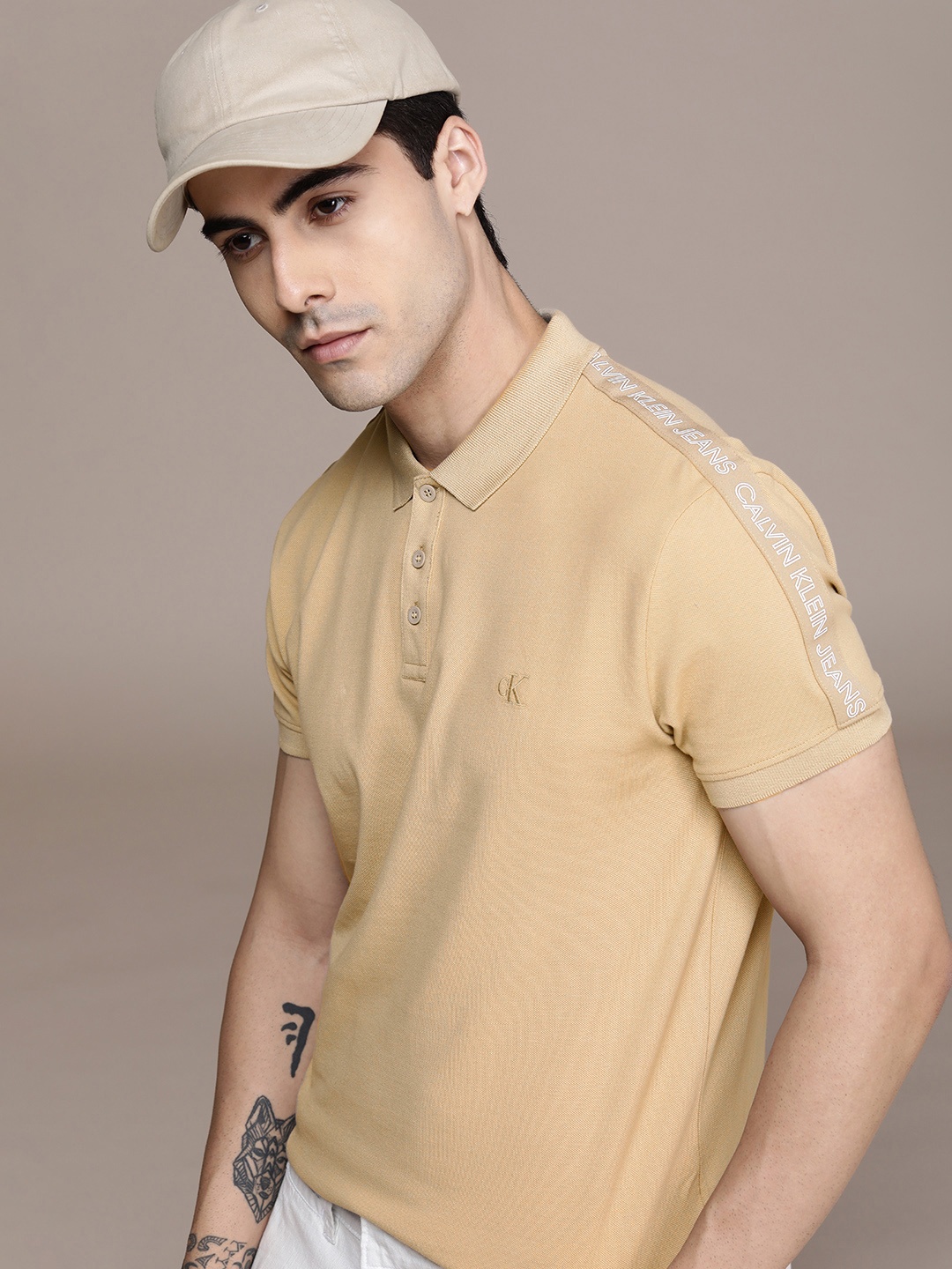 

Calvin Klein Jeans Men Beige Typography Printed Polo Collar Slim Fit Casual T-shirt