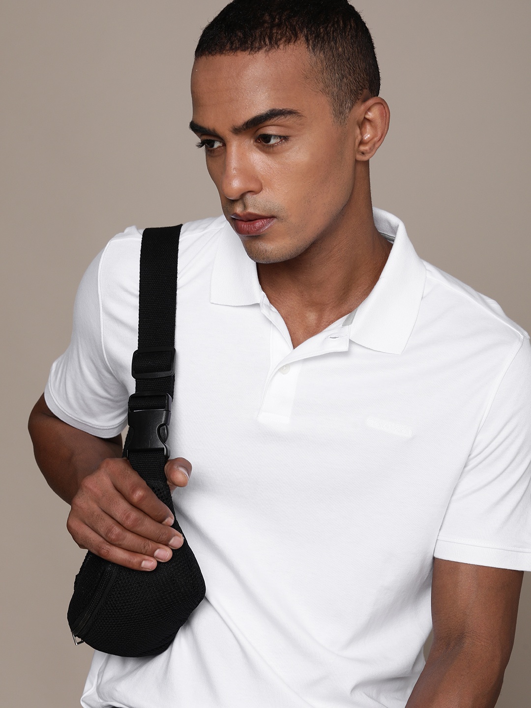 

Calvin Klein Jeans Men White Solid Polo Collar Pure Cotton Casual T-shirt