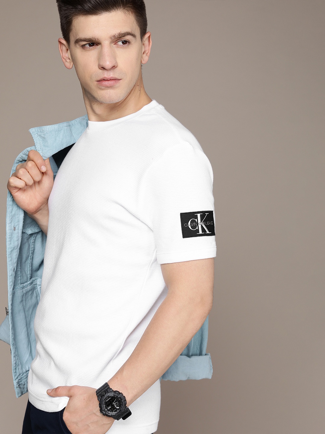 

Calvin Klein Jeans Men Self Design White Pure Cotton T-shirt