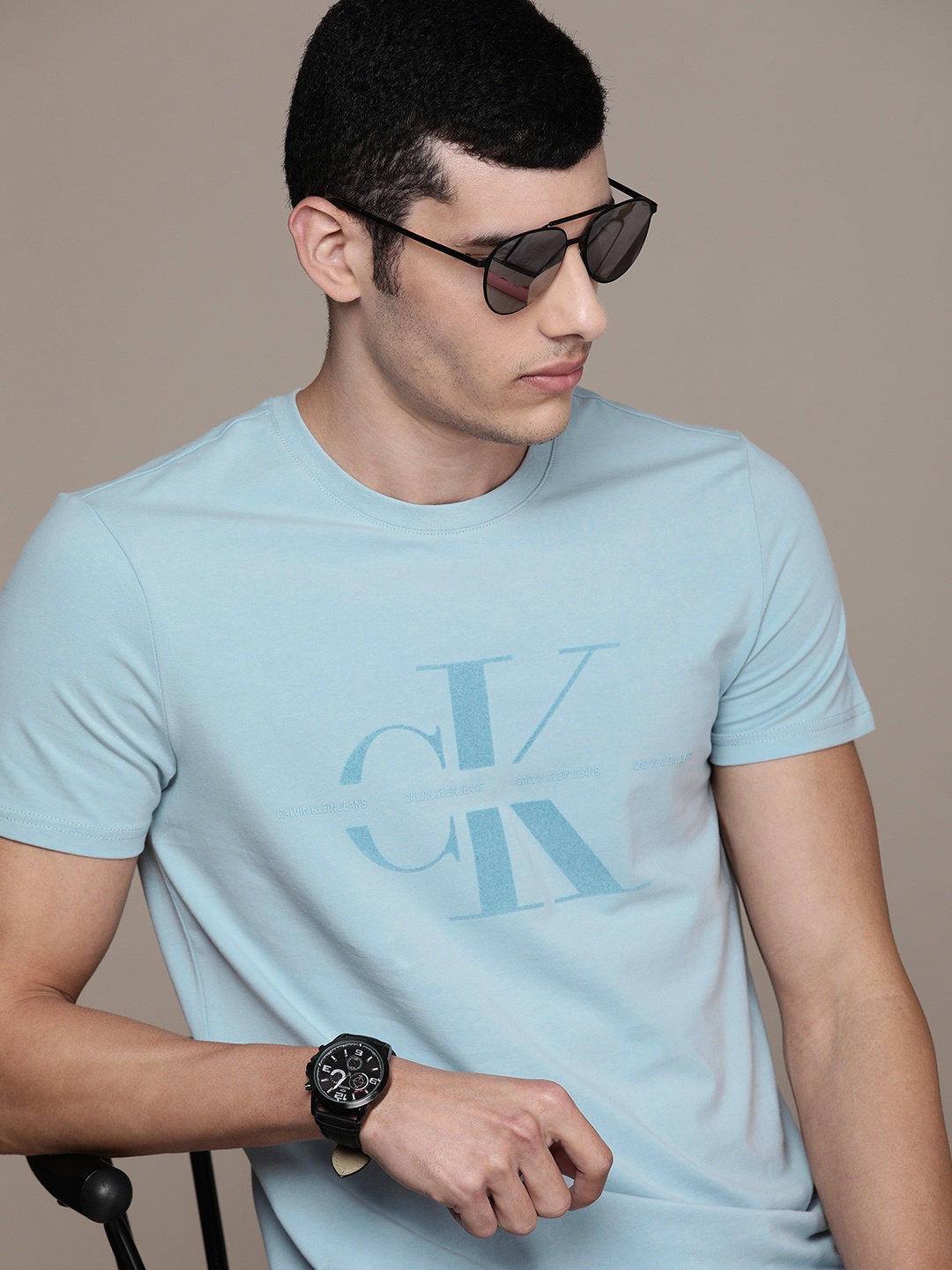 

Calvin Klein Jeans Men Light Blue Logo Printed Slim Fit Casual T-shirt
