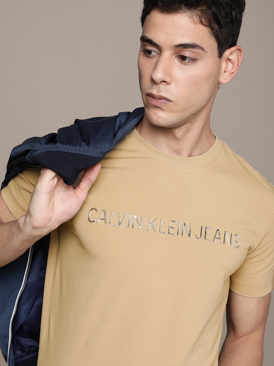 

Calvin Klein Jeans Men Beige Brand Logo Printed Slim Fit T-shirt