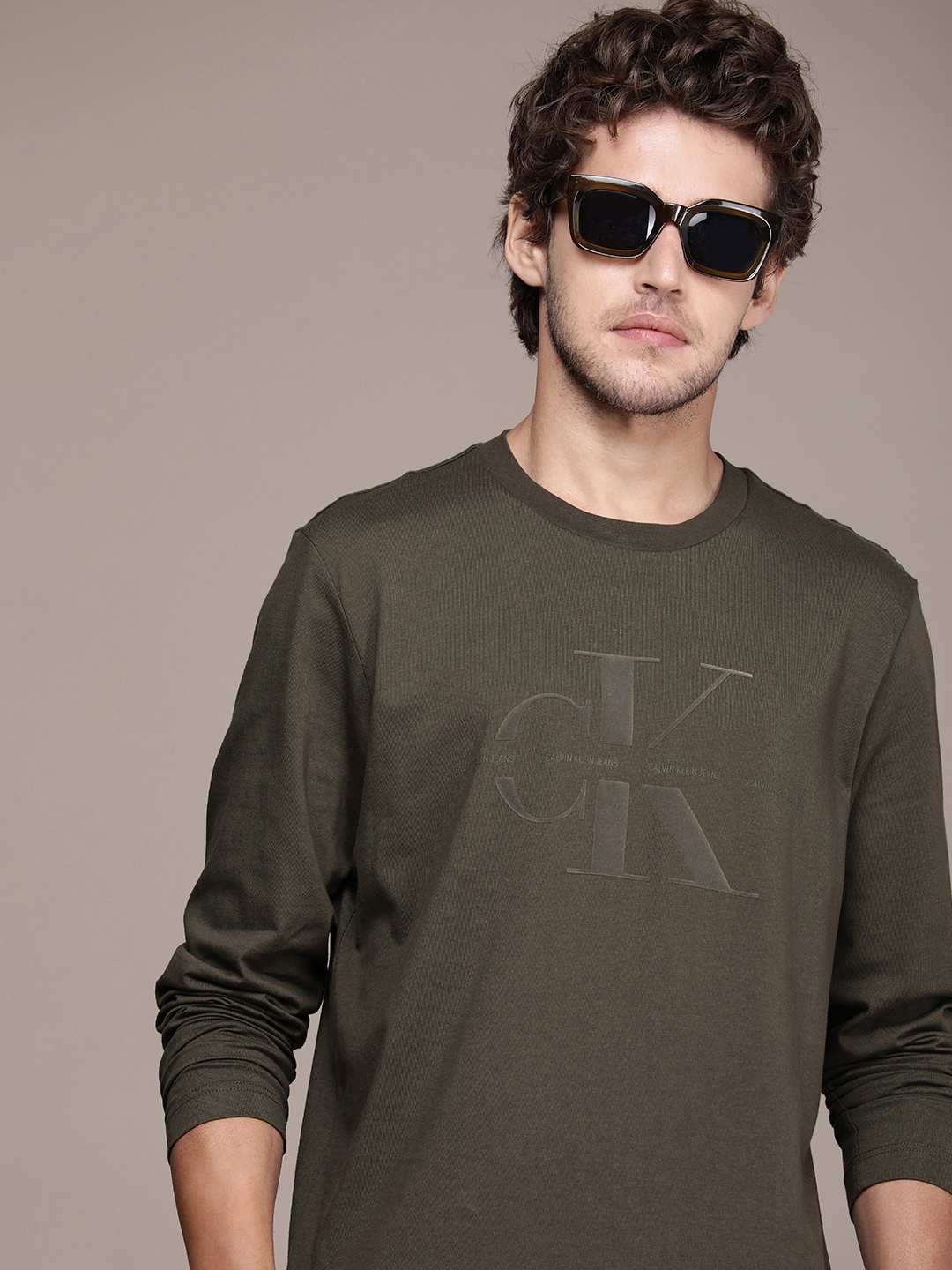 

Calvin Klein Jeans Men Olive Green Flock Printed Pure Cotton Casual T-shirt
