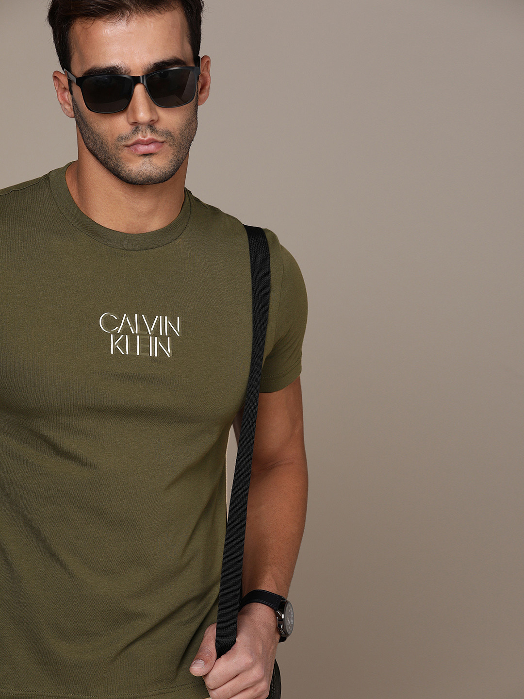 

Calvin Klein Jeans Men Olive Green Brand Logo Printed T-shirt
