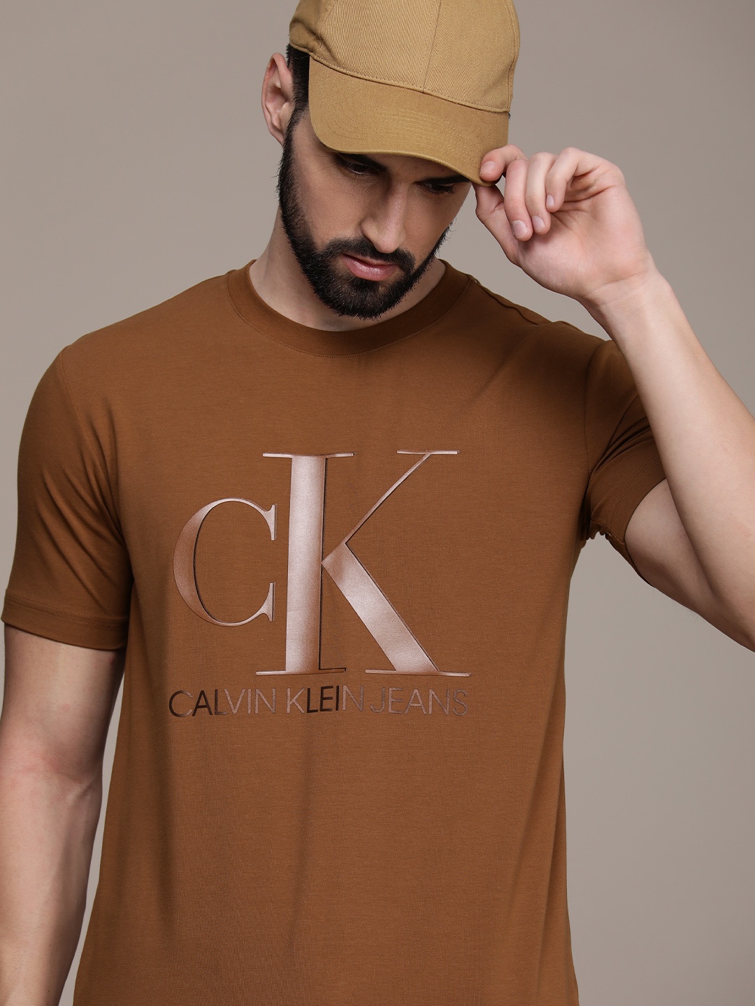 

Calvin Klein Jeans Men Brown Brand Logo Printed Slim Fit T-shirt
