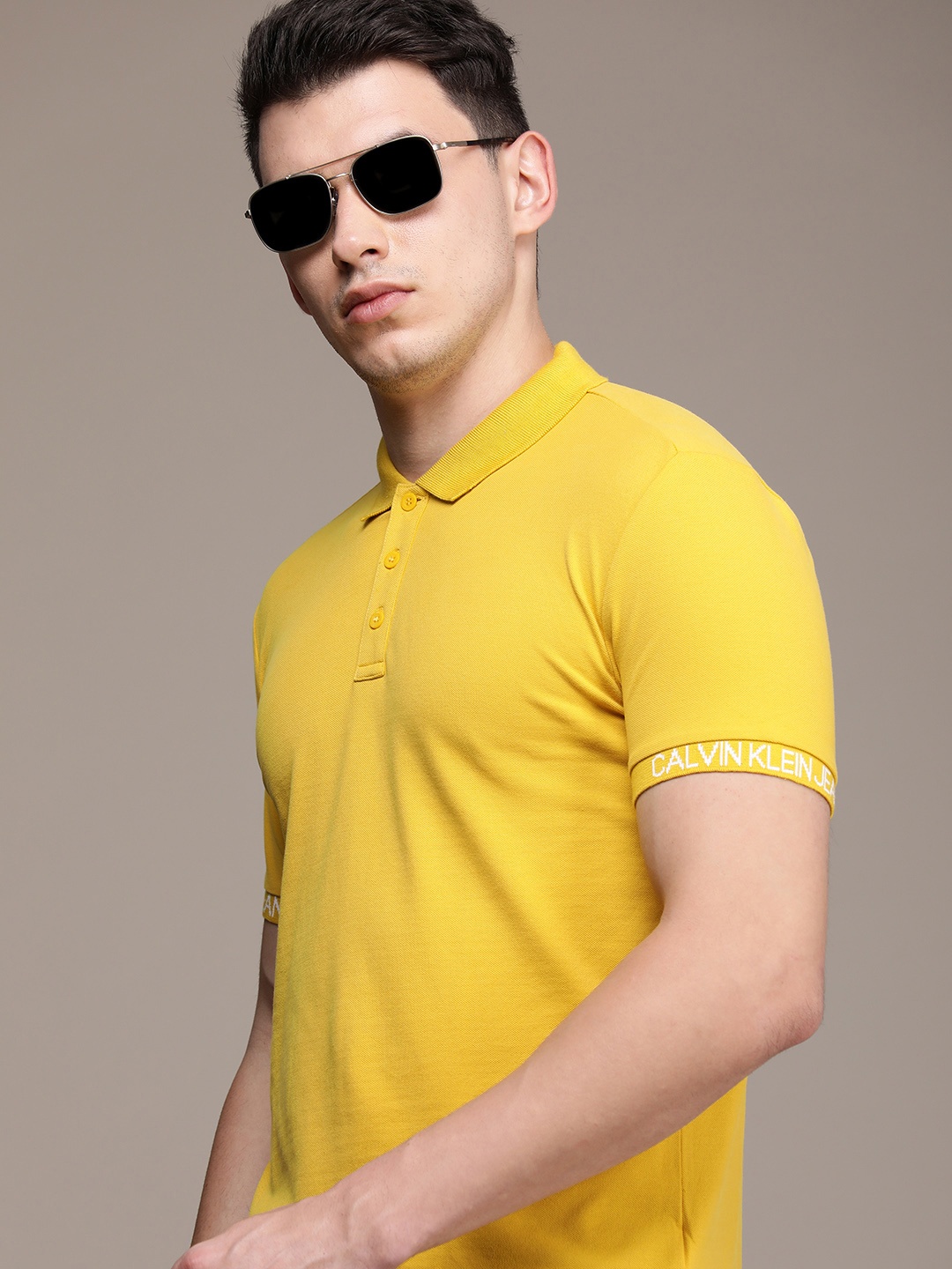 

Calvin Klein Jeans Men Yellow Brand Logo Polo Collar Slim Fit T-shirt
