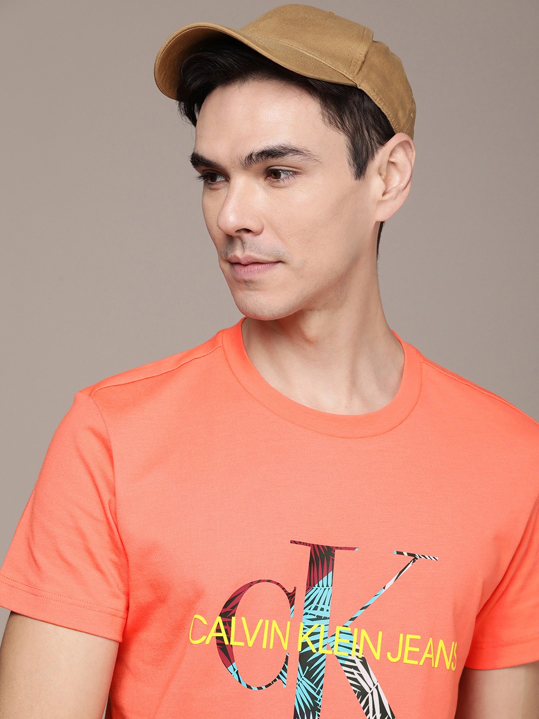 

Calvin Klein Jeans Men Orange & Yellow Printed T-shirt