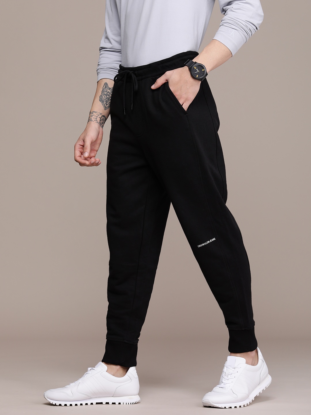

Calvin Klein Jeans Men Black Brand Logo Printed Regular Fit Pure Cotton Joggers