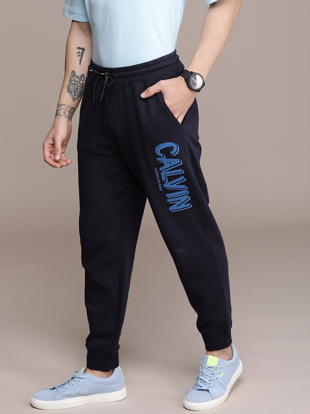

Calvin Klein Jeans Men Blue Printed Wrinkle Free Casual Joggers