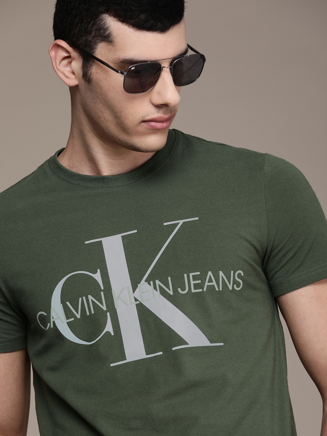 

Calvin Klein Jeans Men Olive Green Logo Printed Slim Fit Casual T-shirt