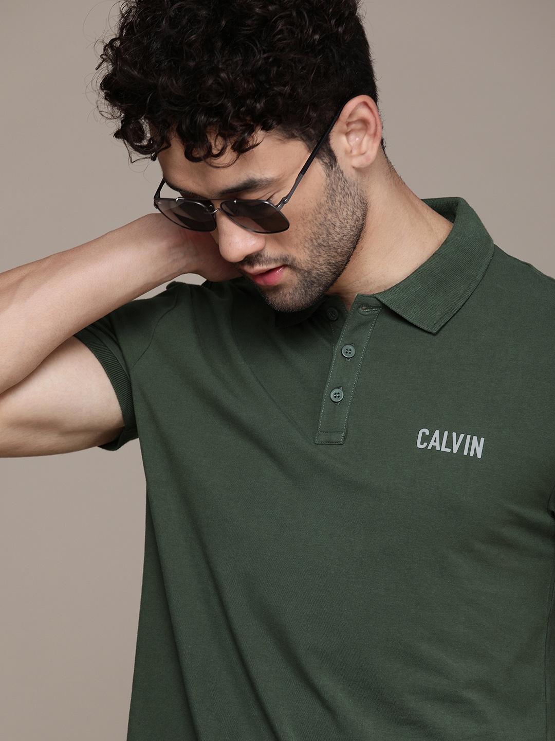 

Calvin Klein Jeans Men Olive Green Logo Printed Polo Collar Slim Fit Casual T-shirt
