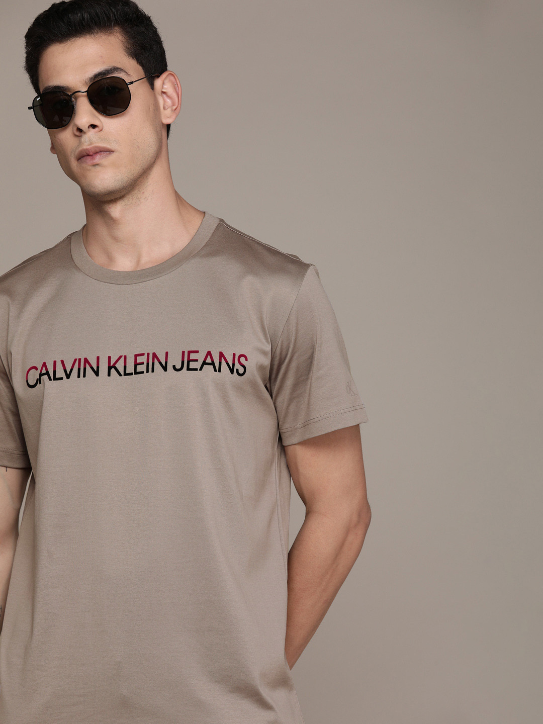 

Calvin Klein Jeans Men Beige Brand Logo Printed Pure Cotton T-shirt