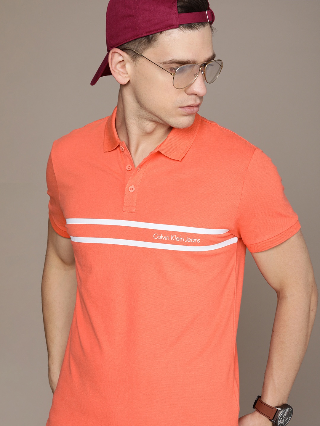 

Calvin Klein Jeans Men Coral Orange & White Striped Polo Collar Slim Fit T-shirt