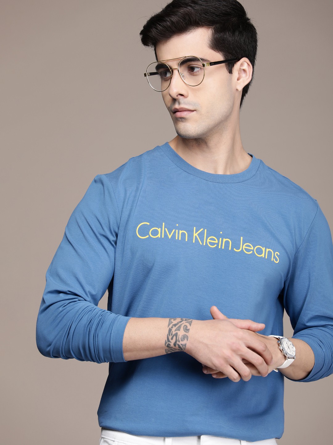 

Calvin Klein Jeans Men Blue & Yellow Typography Printed Casual T-shirt