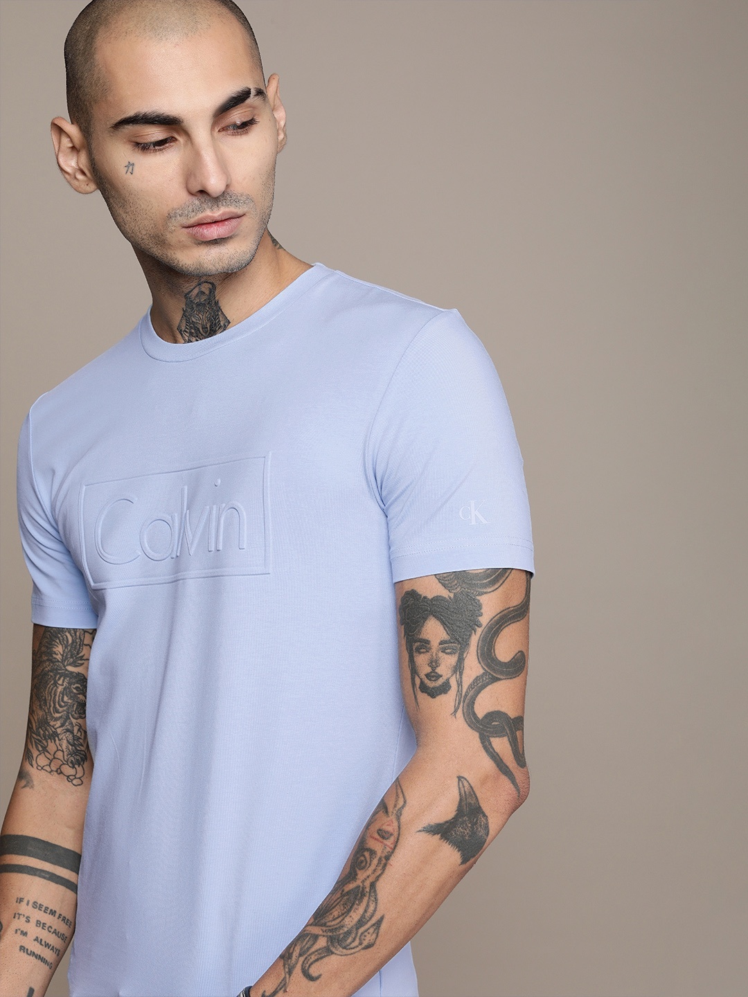 

Calvin Klein Jeans Men Blue Brand Logo Embossed Slim Fit T-shirt