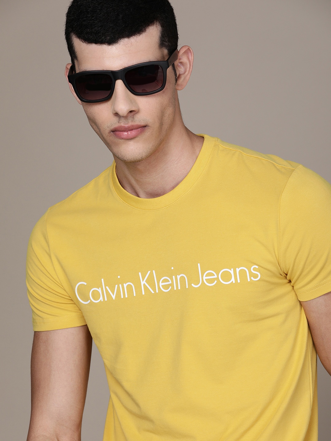 

Calvin Klein Jeans Men Yellow Logo Printed Slim Fit Casual T-shirt