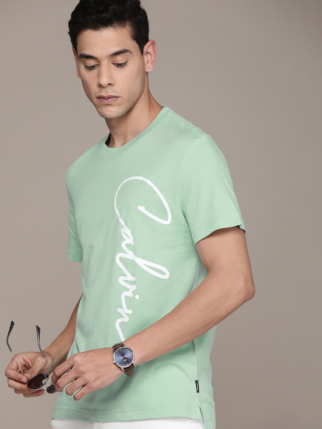 

Calvin Klein Jeans Men Sea Green Brand Logo Printed Pure Cotton T-shirt