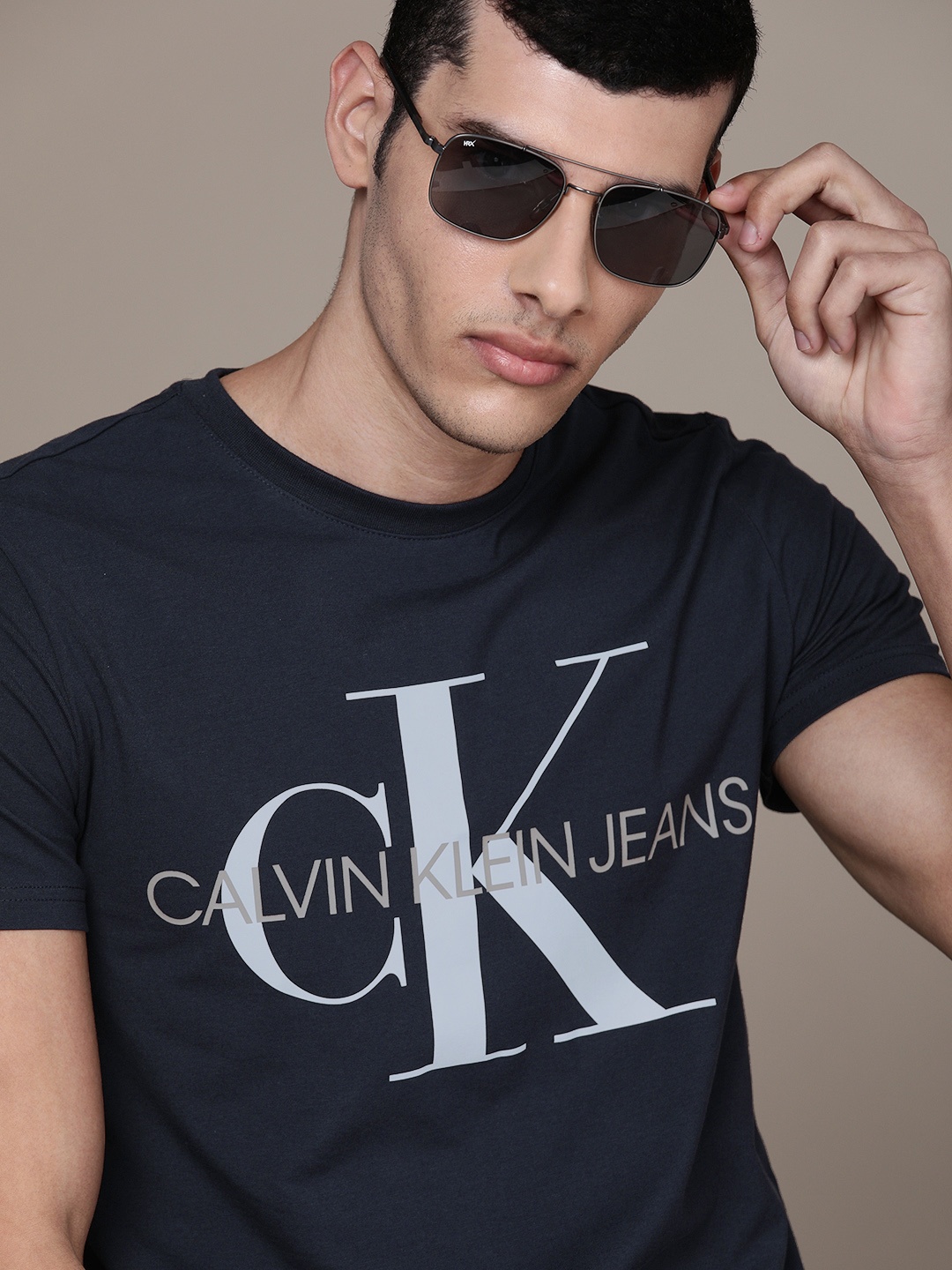 

Calvin Klein Jeans Men Navy Blue Logo Printed Slim Fit Casual T-shirt