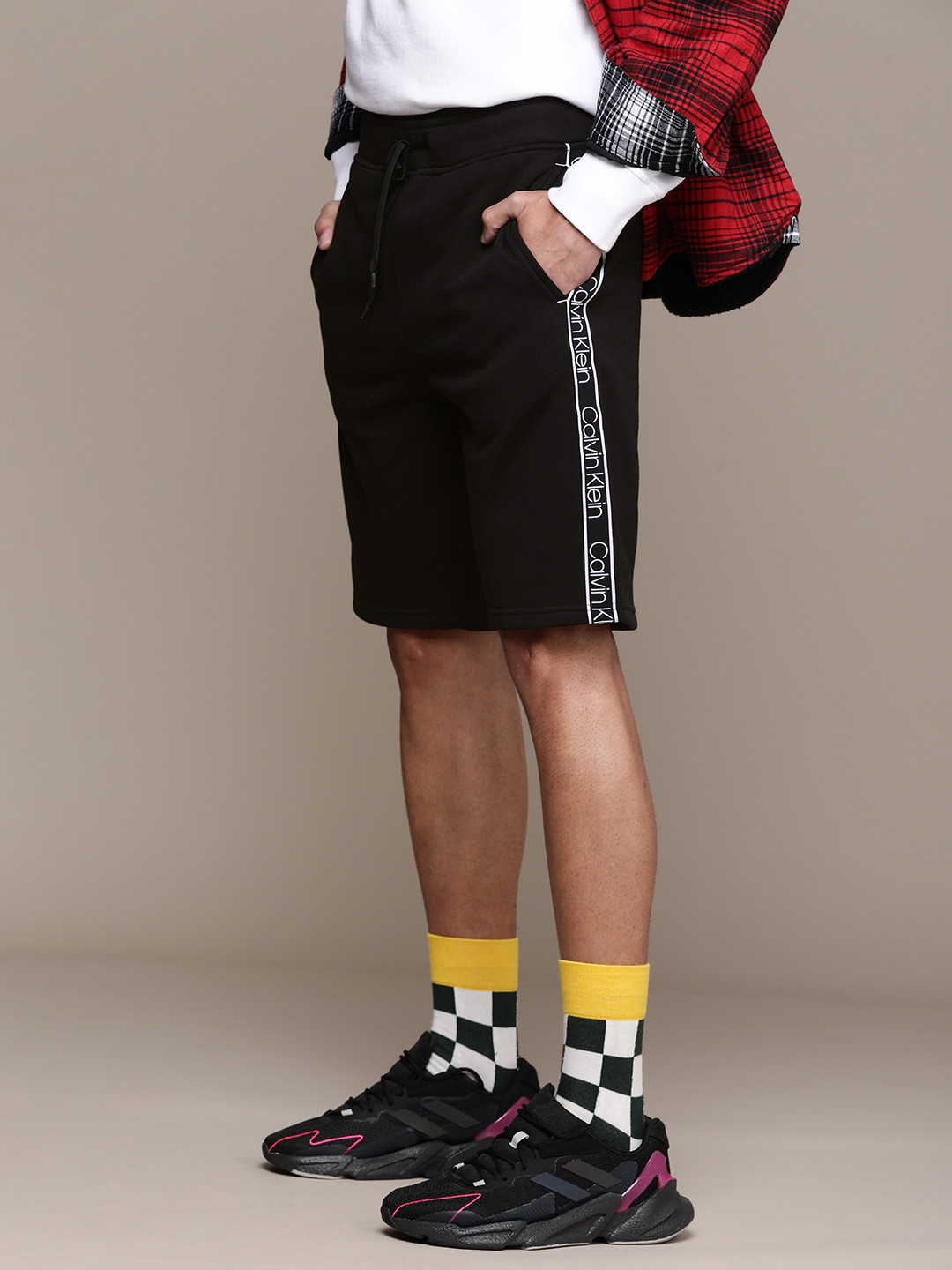 

Calvin Klein Jeans Men Black Regular Shorts with Side Taping Detail
