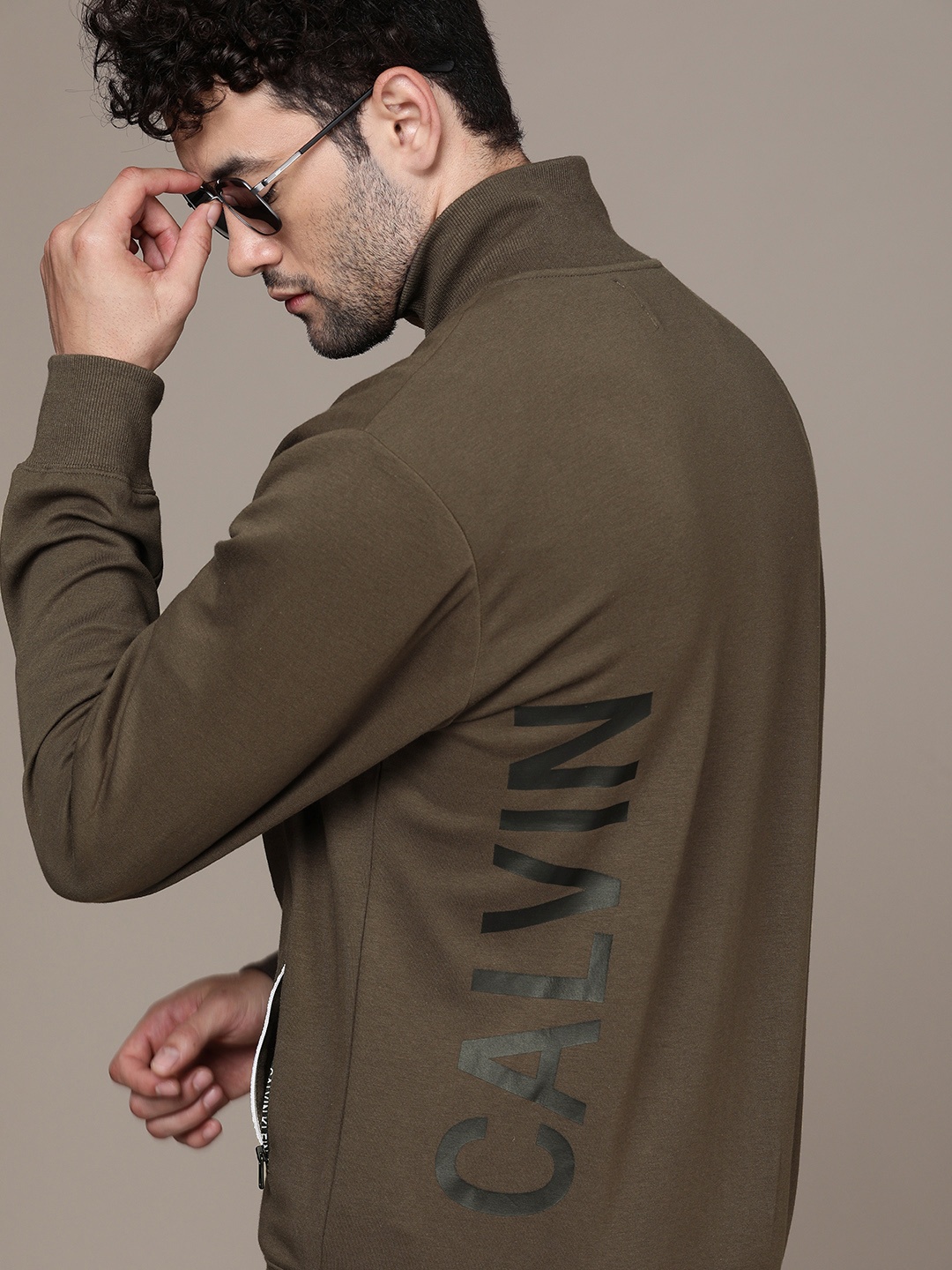 

Calvin Klein Jeans Men Olive Green Brand Logo Printed Sweatshirt