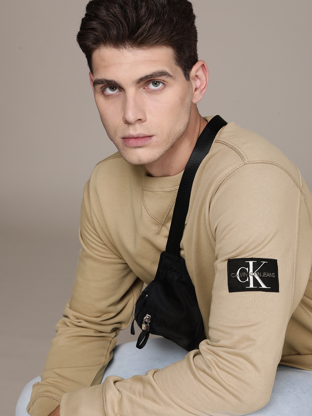 

Calvin Klein Jeans Men Beige Solid Sweatshirt