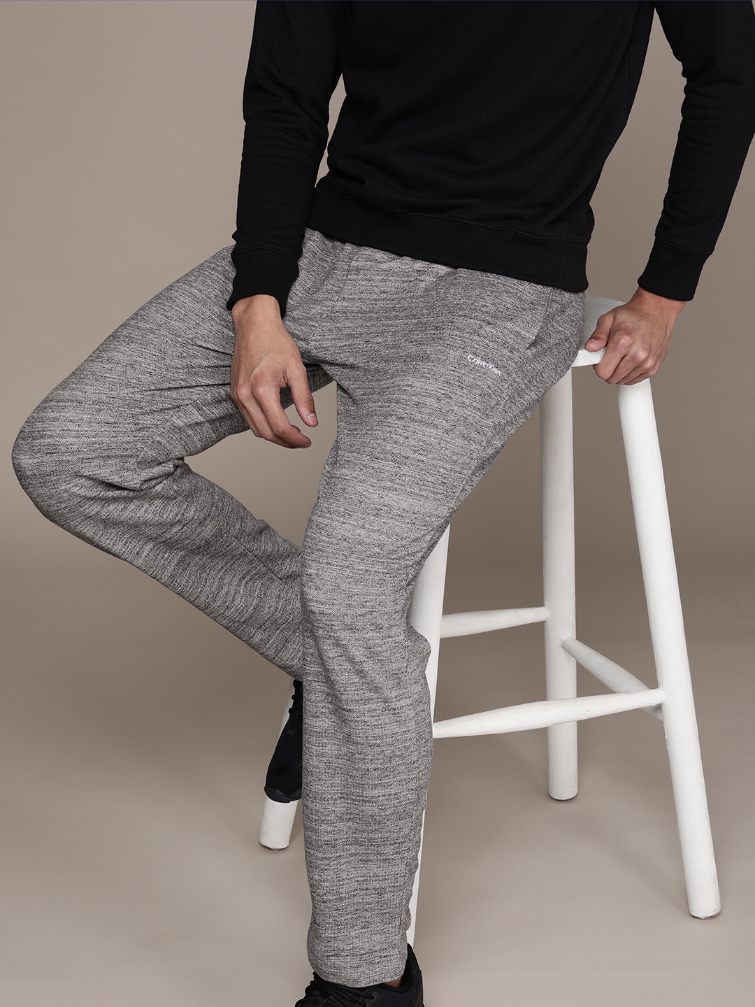 

Calvin Klein Jeans Men Grey Self-Design Jogger Trousers