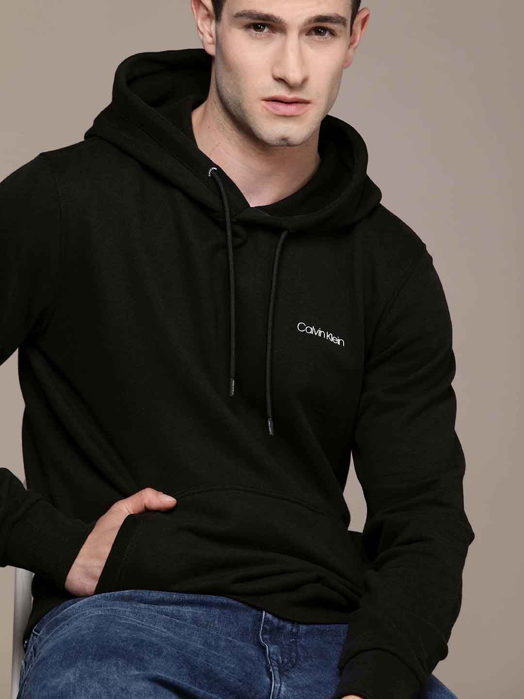 

Calvin Klein Jeans Men Black Solid Hooded Sweatshirt