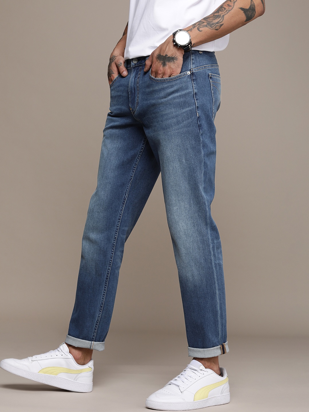 

Calvin Klein Jeans Men Blue Body Tapered Fit Light Fade Stretchable Jeans