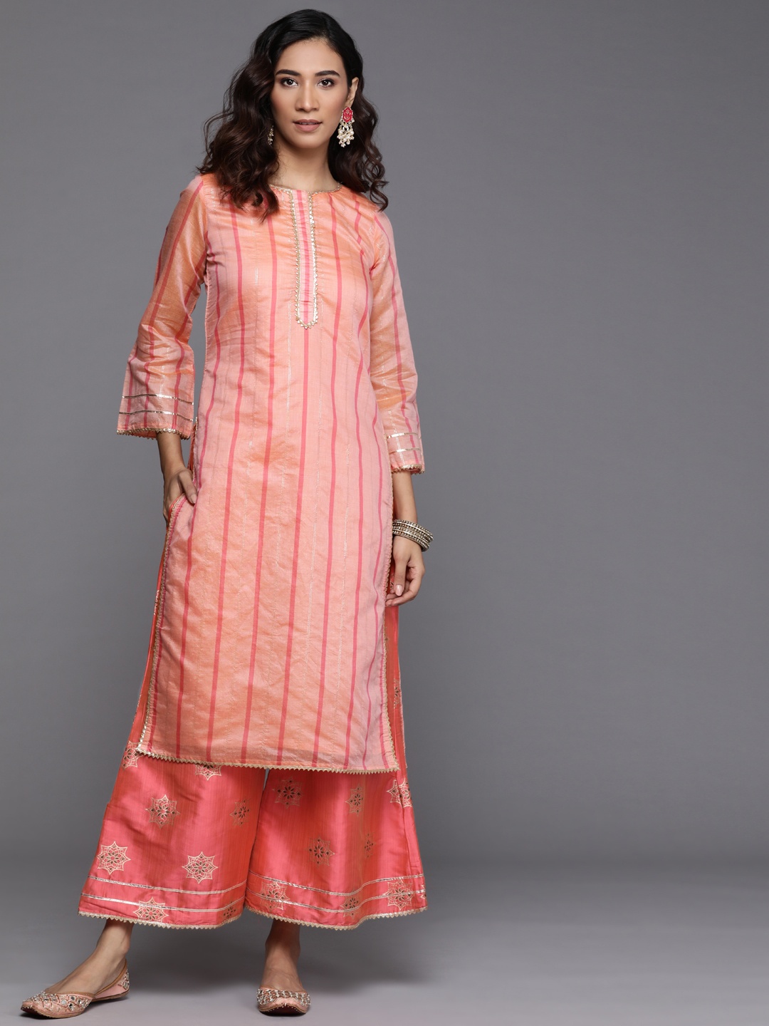 

Libas Women Coral Pink Striped Chanderi Silk Kurta with Palazzos