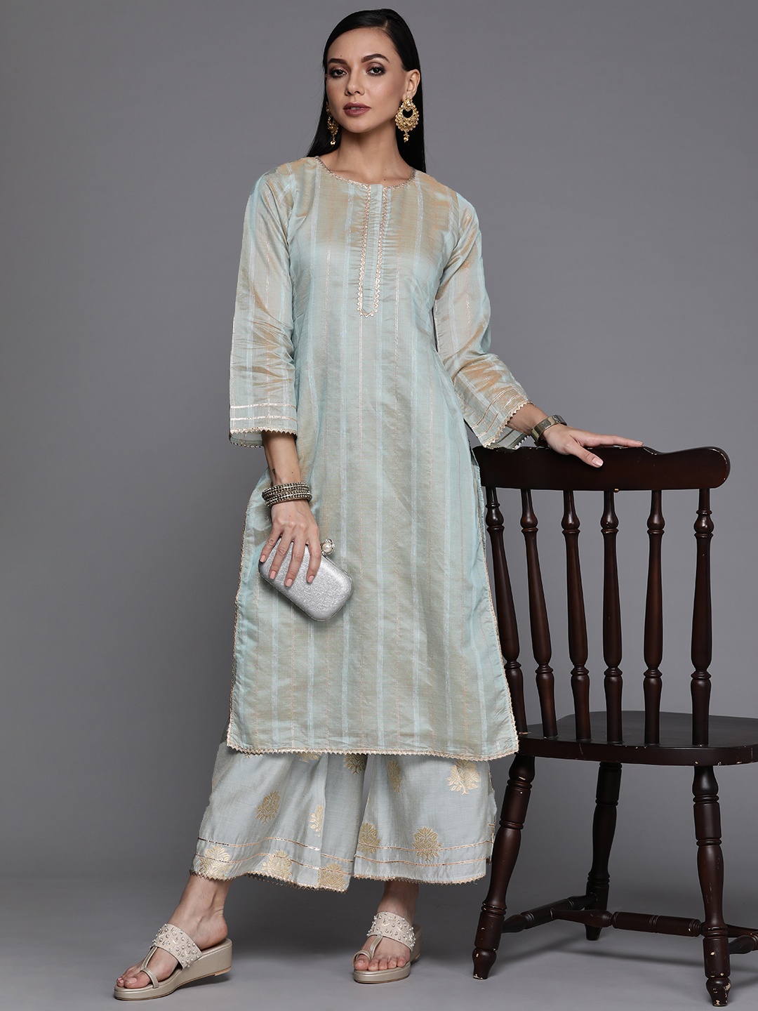 

Libas Women Grey & Golden Striped Kurta with Palazzos